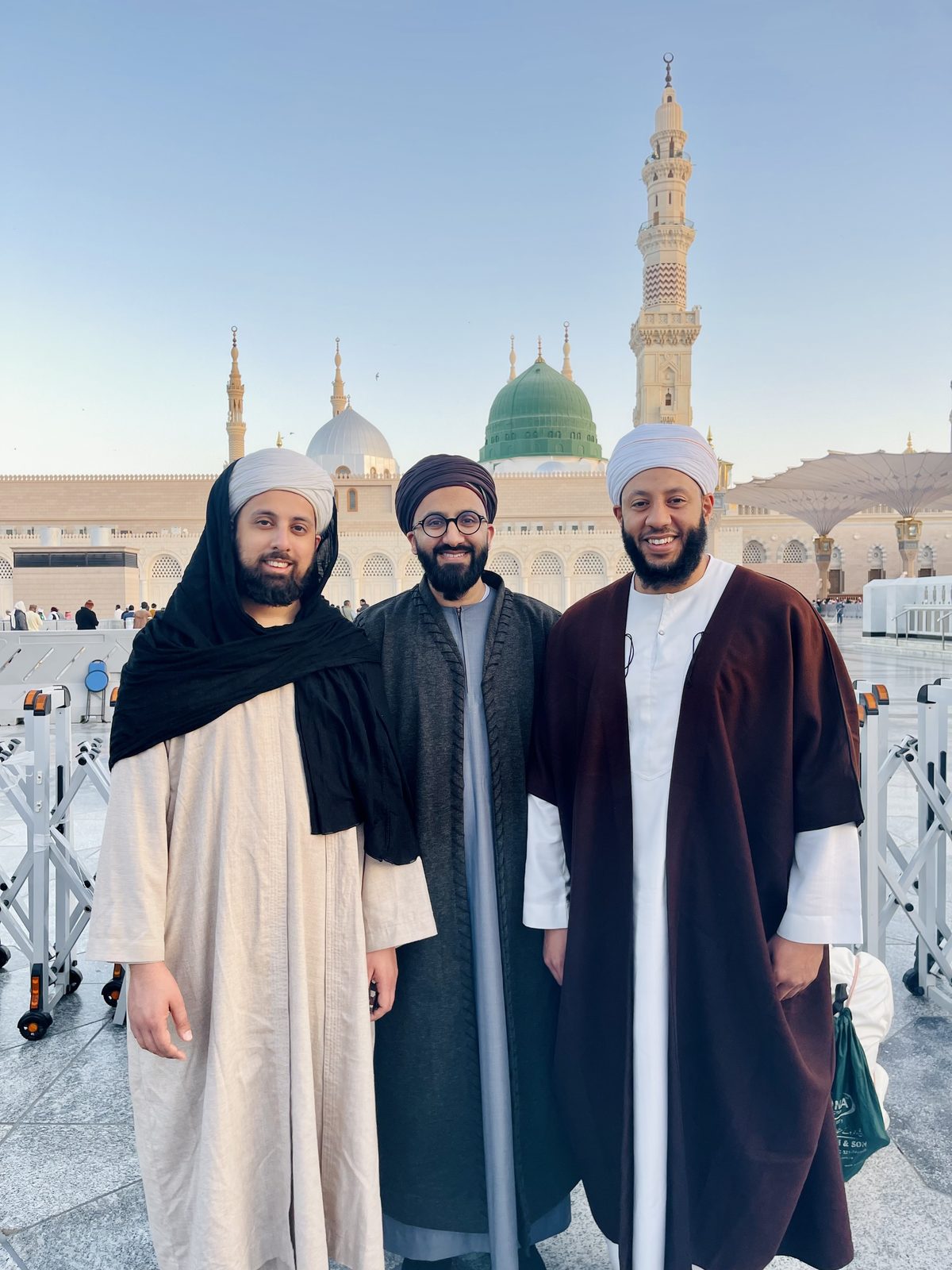 A small group posing in front of the Prophet's Mosque