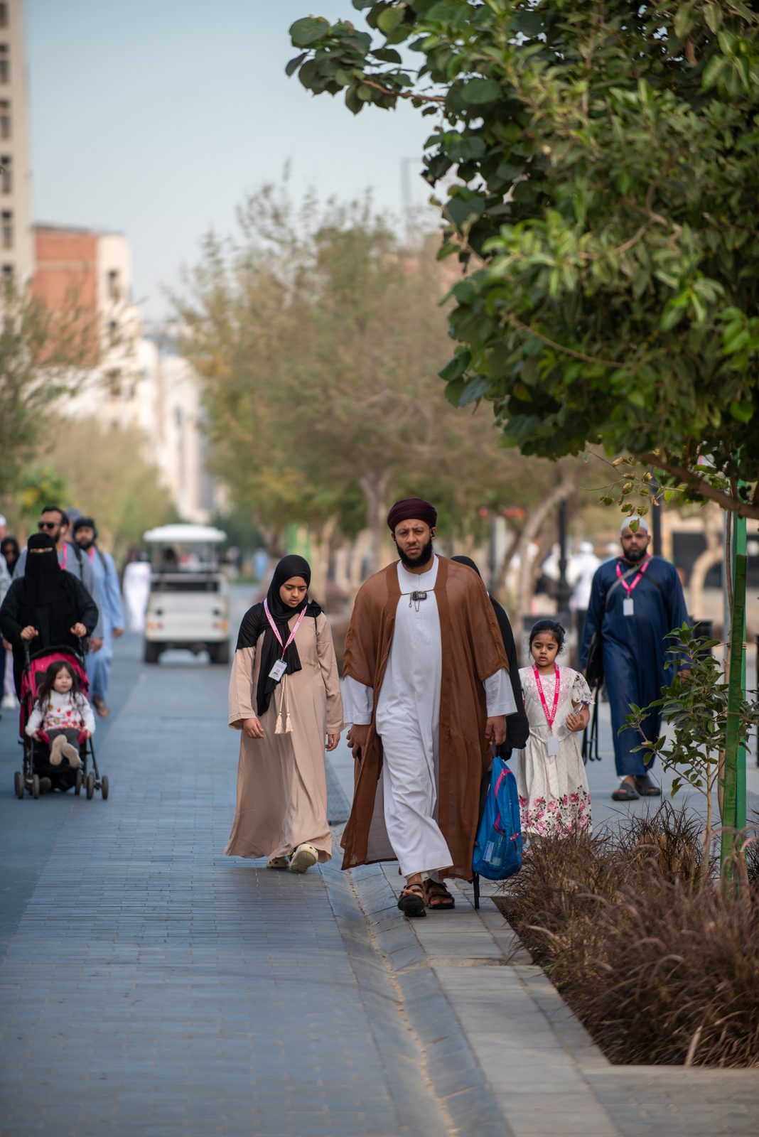A family walking together through the streets of Madinah