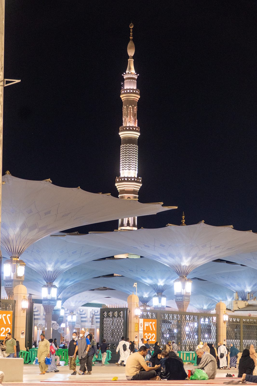 The Prophet's Mosque minaret glowing at night